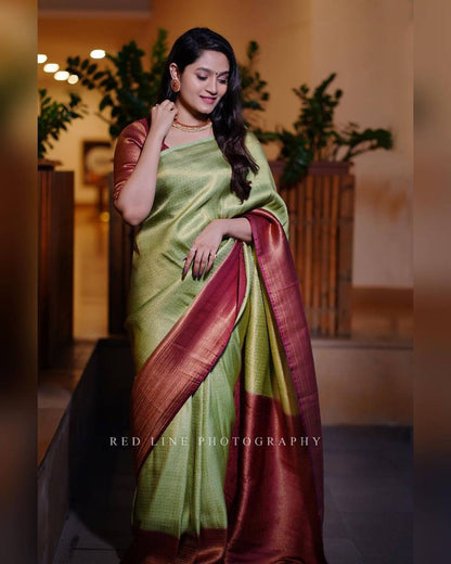 GREENISH WITH MAROON COLOUR BORDER WEAVED WITH COPPER ZARI